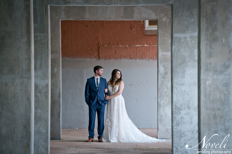 A bride and groom pose in one of Judson Mill's exceptional photo spots.